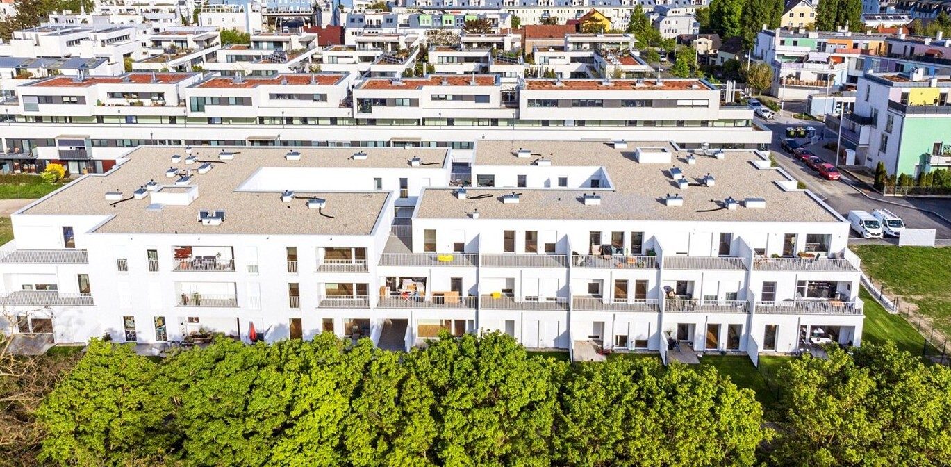 Luftaufnahme der Wohnanlage: Wien-Floridsdorf · Vermietete Gartenwohnung · Neubau 2023 · TG · provisionsfrei