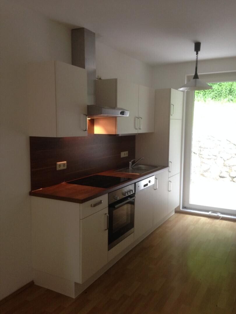 Küche mit Terrassenzugang: Graz-West mit Stadtblick · 2 Zimmer 55 m² + 46 m² Terrasse + Garten · 6 % Rendite · 125.000 €